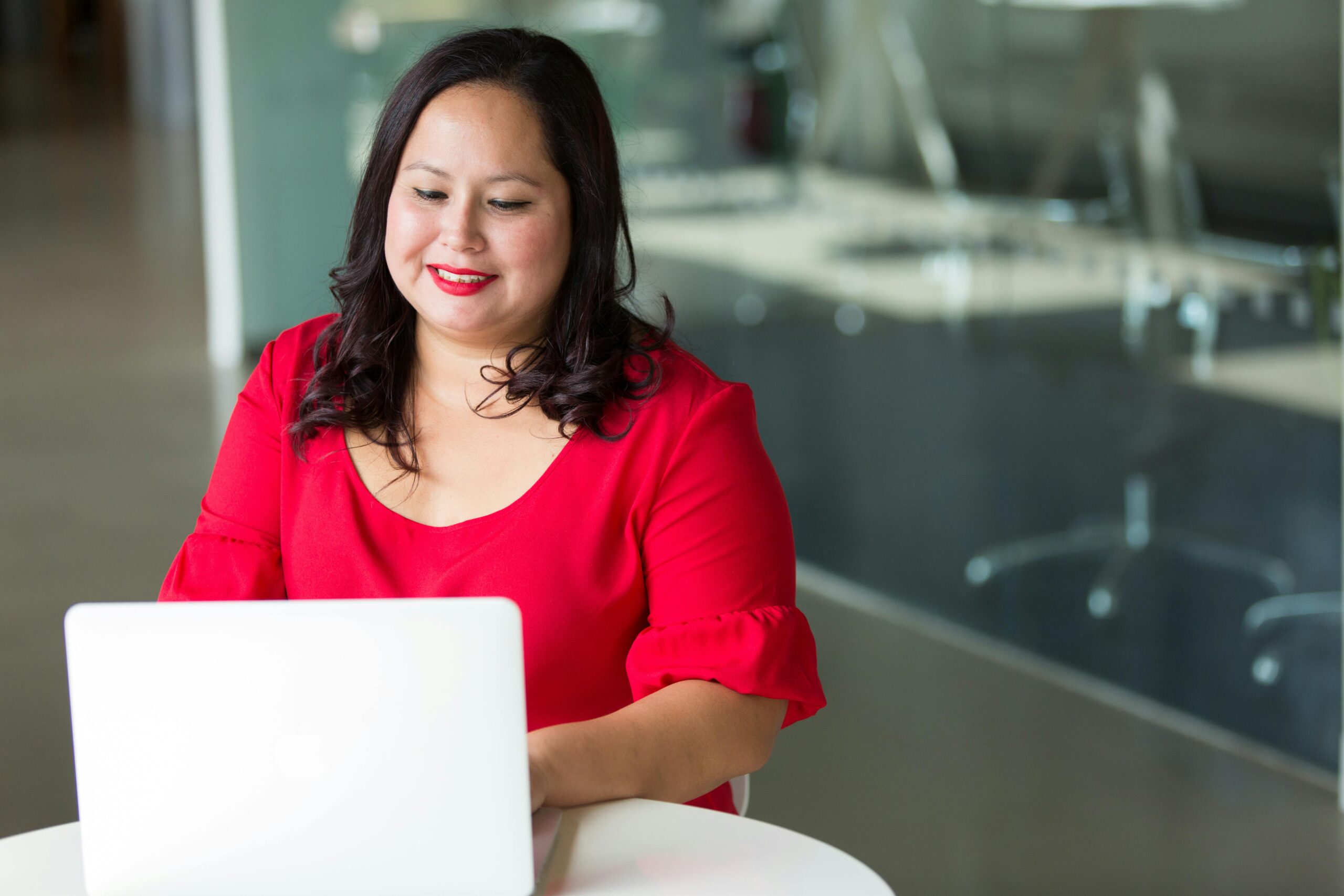A woman mapping out her career development plan on a laptop